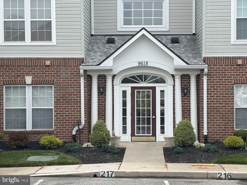 9615 Haven Farm Rd Unit 9615G, Perry Hall, MD 21128 - property entrance with brick siding and roof with shingles