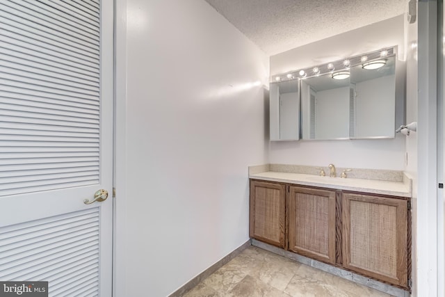 1225 Martha Custis Dr Unit 1210, Alexandria, VA 22302 - bathroom with vanity, baseboards, and a textured ceiling