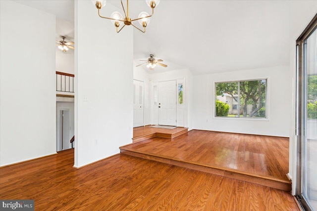167 S Fox Rd, Sterling, VA 20164 - unfurnished living room featuring wood finished floors, healthy amount of natural light, a chandelier, a ceiling fan, and high vaulted ceiling
