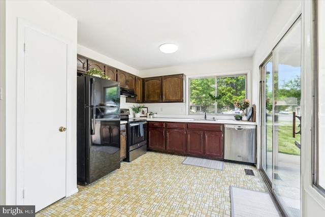 167 S Fox Rd, Sterling, VA 20164 - kitchen with appliances with stainless steel finishes, light countertops, under cabinet range hood, and a sink
