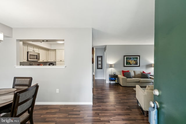 169 Woodlake Dr, Marlton, NJ 08053 - dining area featuring dark wood-style flooring and baseboards
