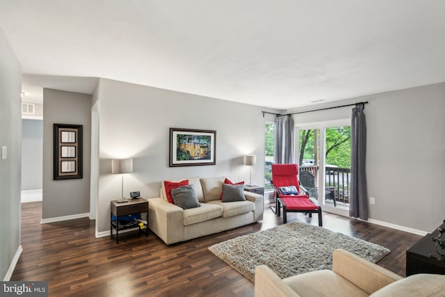 169 Woodlake Dr, Marlton, NJ 08053 - living area with baseboards and dark wood-style flooring