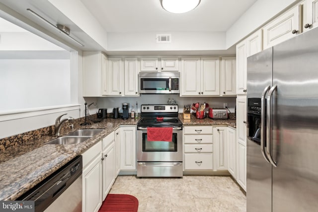 169 Woodlake Dr, Marlton, NJ 08053 - kitchen with stainless steel appliances, a sink, white cabinetry, and dark stone counters