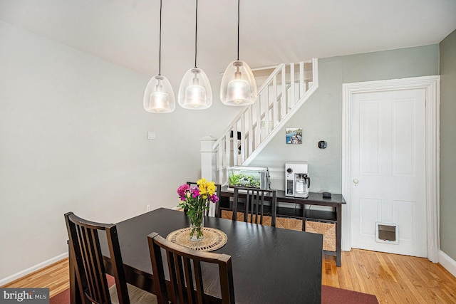 126 Ford St, Conshohocken, PA 19428 - dining area with stairs, wood finished floors, and baseboards