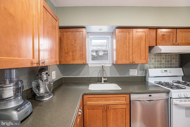126 Ford St, Conshohocken, PA 19428 - kitchen featuring stainless steel dishwasher, white gas range, under cabinet range hood, a sink, and dark countertops