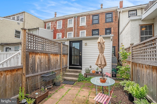 126 Ford St, Conshohocken, PA 19428 - back of property featuring entry steps and a fenced backyard
