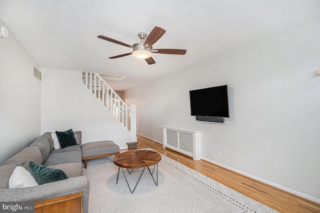 126 Ford St, Conshohocken, PA 19428 - living area featuring stairway, wood finished floors, baseboards, and ceiling fan