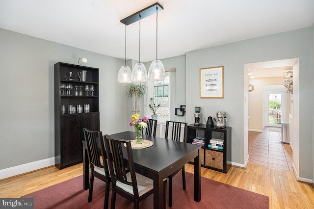 126 Ford St, Conshohocken, PA 19428 - dining space featuring light wood-type flooring, baseboards, and a chandelier