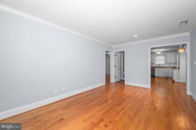 6 E Hamilton Ave, Silver Spring, MD 20901 - unfurnished living room featuring baseboards, ornamental molding, light wood finished floors, recessed lighting, and a sink