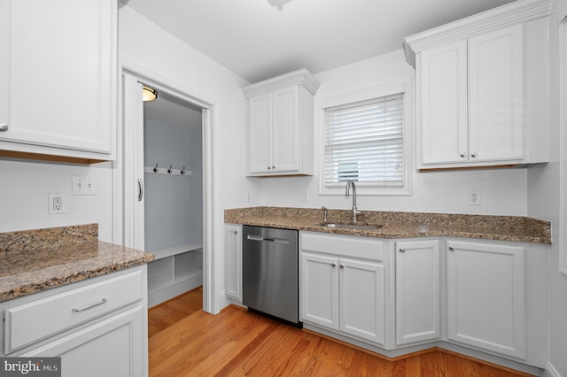 6 E Hamilton Ave, Silver Spring, MD 20901 - kitchen featuring stainless steel dishwasher, a sink, light wood-style floors, white cabinets, and dark stone counters