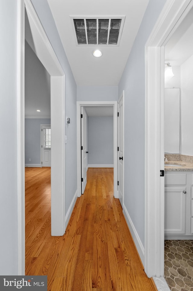 6 E Hamilton Ave, Silver Spring, MD 20901 - corridor featuring light wood-style floors, a sink, recessed lighting, and baseboards