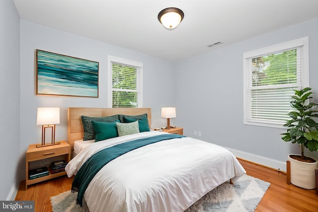 6 E Hamilton Ave, Silver Spring, MD 20901 - bedroom with baseboards and light wood-style floors