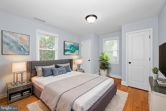 6 E Hamilton Ave, Silver Spring, MD 20901 - bedroom with multiple windows, light wood finished floors, and baseboards