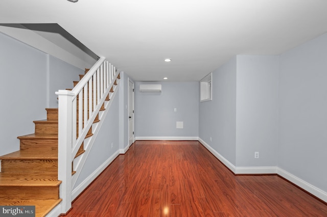 6 E Hamilton Ave, Silver Spring, MD 20901 - finished below grade area with a wall mounted AC, wood finished floors, stairway, baseboards, and recessed lighting