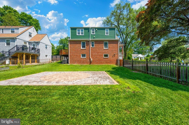 6 E Hamilton Ave, Silver Spring, MD 20901 - back of house with brick siding, a patio, central AC unit, and a deck