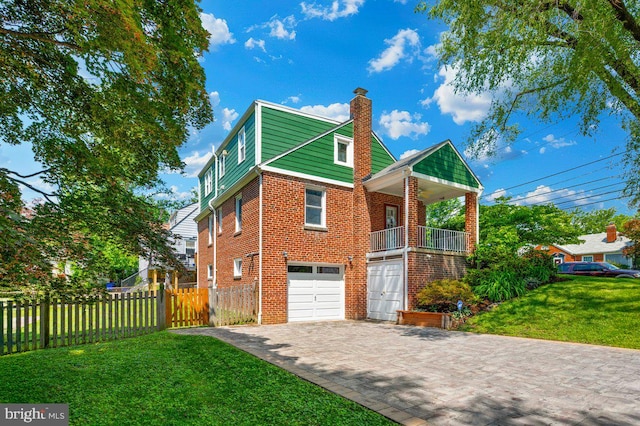 6 E Hamilton Ave, Silver Spring, MD 20901 - view of property exterior with a chimney, brick siding, an attached garage, and driveway