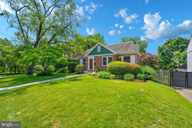 6 E Hamilton Ave, Silver Spring, MD 20901 - view of front facade featuring brick siding, a chimney, and a gate