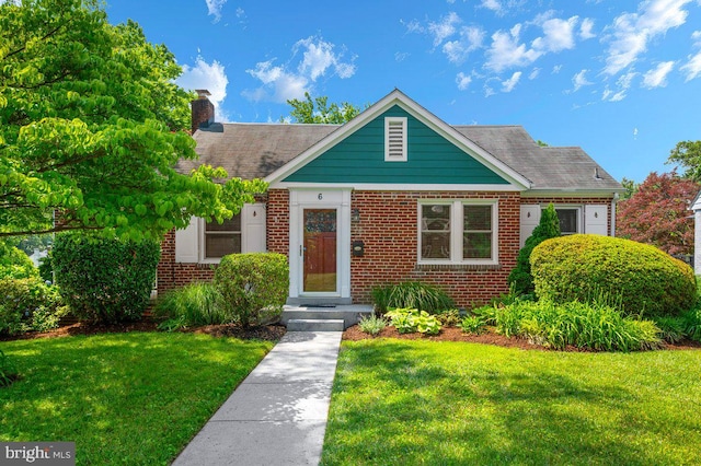 6 E Hamilton Ave, Silver Spring, MD 20901 - bungalow-style house featuring a front lawn, brick siding, and a chimney