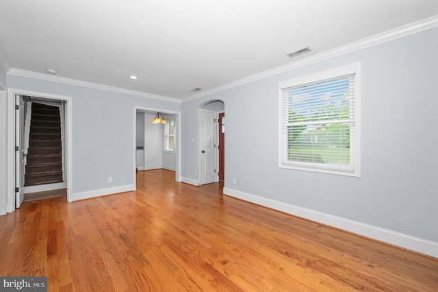 6 E Hamilton Ave, Silver Spring, MD 20901 - unfurnished room with baseboards, arched walkways, ornamental molding, and light wood-style floors