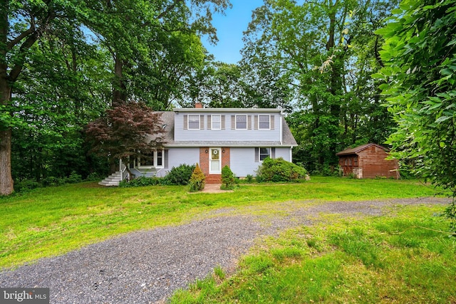 13931 Eagles Nest Farm Ln, Betterton, MD 21610 - colonial inspired home with a front yard, an outbuilding, a chimney, and gravel driveway