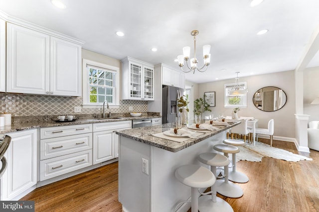10510 Vincent Rd, White Marsh, MD 21162 - kitchen with stainless steel refrigerator with ice dispenser, tasteful backsplash, a kitchen breakfast bar, white cabinets, and recessed lighting