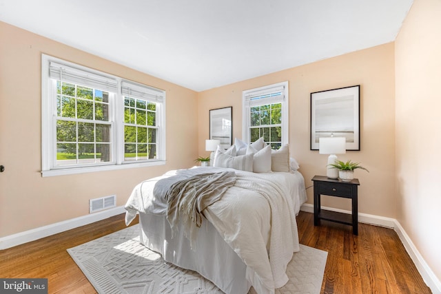 10510 Vincent Rd, White Marsh, MD 21162 - bedroom featuring multiple windows and wood finished floors