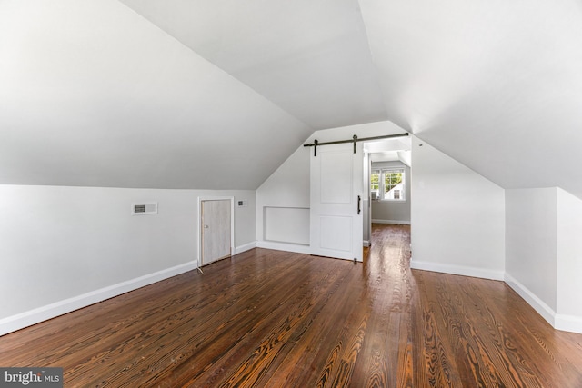 10510 Vincent Rd, White Marsh, MD 21162 - additional living space with dark wood-style flooring, lofted ceiling, and a barn door