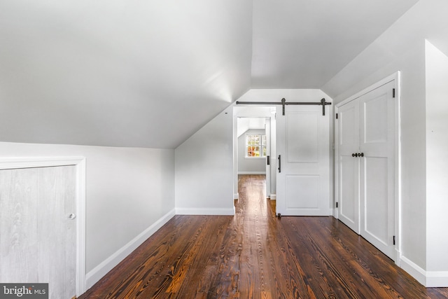 10510 Vincent Rd, White Marsh, MD 21162 - bonus room featuring vaulted ceiling, dark wood-style floors, and a barn door