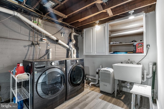 10510 Vincent Rd, White Marsh, MD 21162 - washroom featuring cabinet space, washer and clothes dryer, and wood finished floors