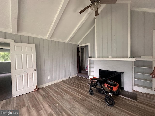 17286 Apple Tree Rd, Bridgeville, DE 19933 - unfurnished living room with wood finished floors, a brick fireplace, a ceiling fan, and wooden walls