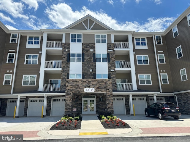 406-203 Bold Ruler Ct, Havre De Grace, MD 21078 - view of apartment building / complex featuring an attached garage and driveway