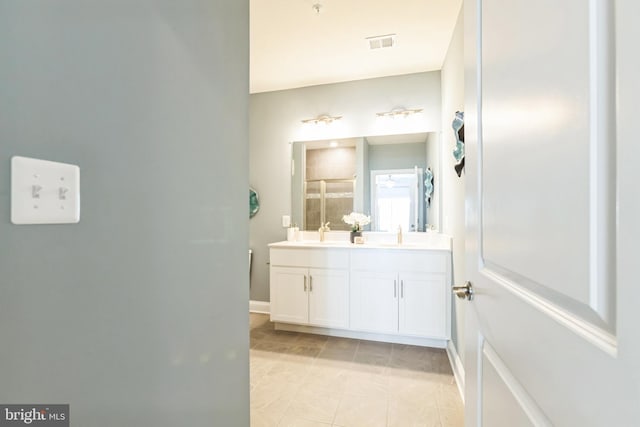 406-203 Bold Ruler Ct, Havre De Grace, MD 21078 - bathroom with double vanity, a shower with door, baseboards, and tile patterned floors
