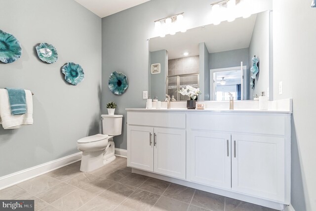 406-203 Bold Ruler Ct, Havre De Grace, MD 21078 - bathroom with double vanity, toilet, baseboards, and a shower stall