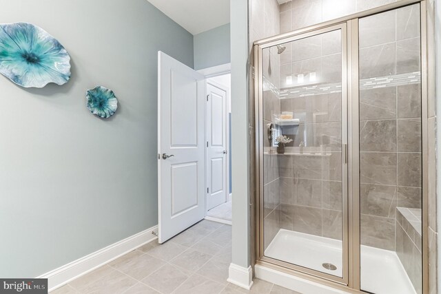 406-203 Bold Ruler Ct, Havre De Grace, MD 21078 - bathroom featuring a stall shower, baseboards, and tile patterned flooring