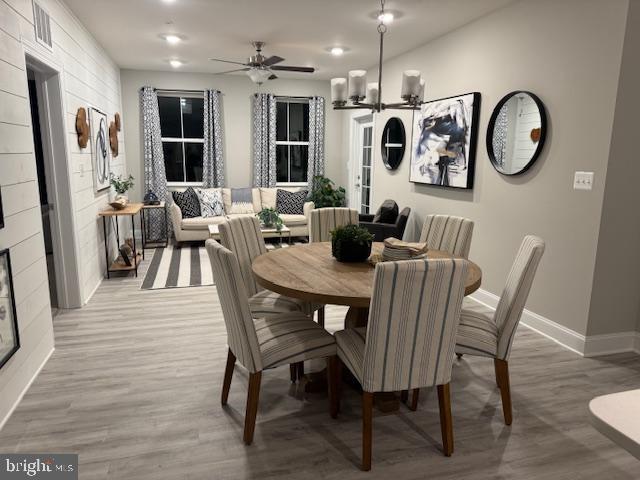 406-203 Bold Ruler Ct, Havre De Grace, MD 21078 - dining area featuring baseboards, light wood-style flooring, and a ceiling fan