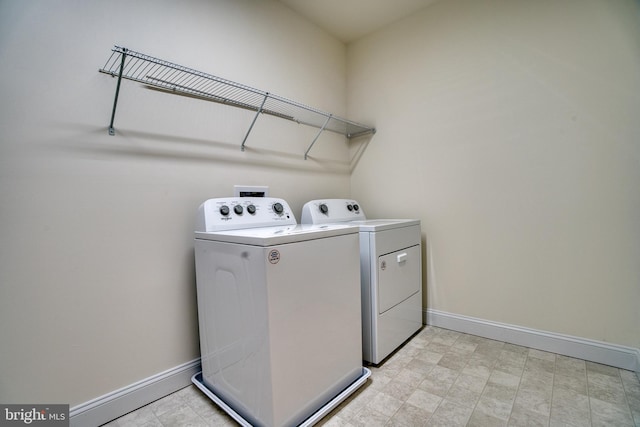 406-203 Bold Ruler Ct, Havre De Grace, MD 21078 - laundry area with washer and dryer and baseboards