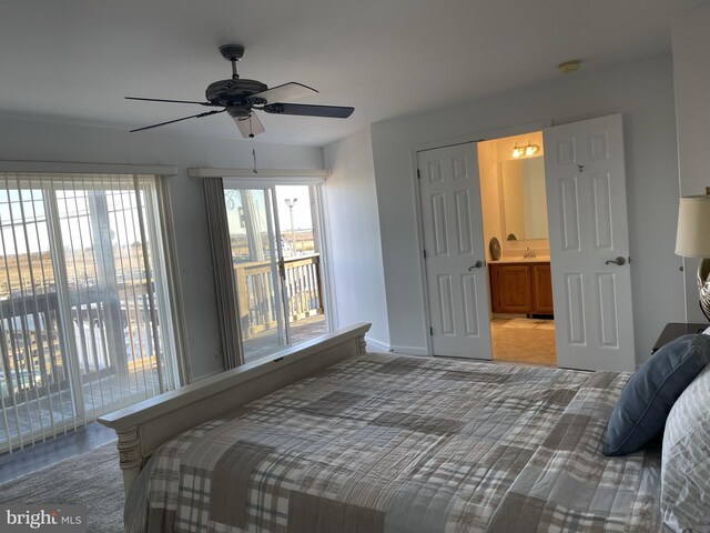 557 Launch Ave, Somers Point, NJ 08244 - bedroom with access to exterior, baseboards, connected bathroom, and a ceiling fan