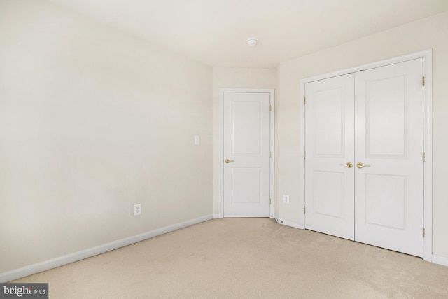 9207 Cascade Falls Dr, Bristow, VA 20136 - unfurnished bedroom with light carpet, baseboards, and a closet
