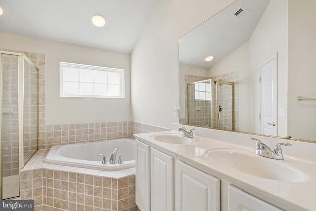 9207 Cascade Falls Dr, Bristow, VA 20136 - full bathroom featuring a bath, a shower stall, double vanity, and lofted ceiling