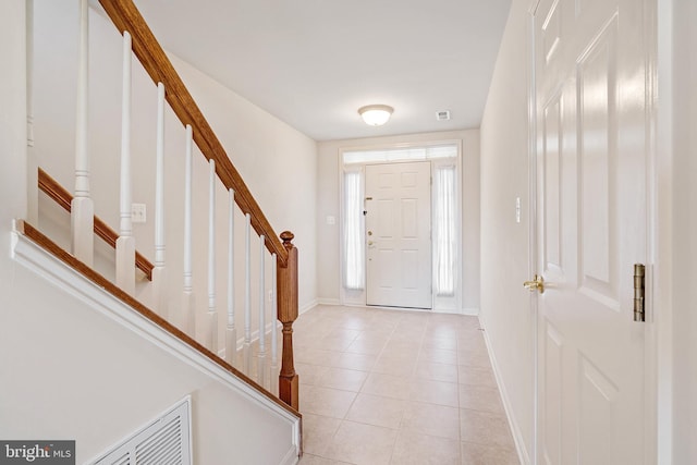 9207 Cascade Falls Dr, Bristow, VA 20136 - foyer with stairs, baseboards, and light tile patterned floors