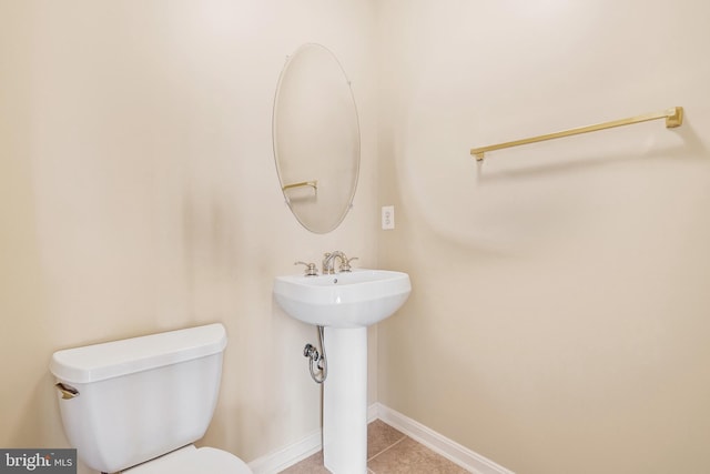 9207 Cascade Falls Dr, Bristow, VA 20136 - bathroom featuring toilet, tile patterned floors, baseboards, and a sink