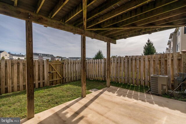 9207 Cascade Falls Dr, Bristow, VA 20136 - fenced backyard featuring cooling unit and a patio