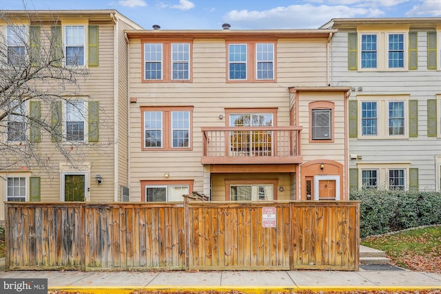 14629 Monmouth Dr Unit 10-112, Burtonsville, MD 20866 - rear view of house with a fenced front yard and a balcony