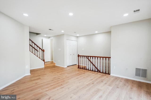 14629 Monmouth Dr Unit 10-112, Burtonsville, MD 20866 - empty room featuring light wood-style floors, recessed lighting, baseboards, and stairs