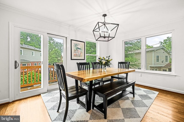 3311 Cameron Mills Rd, Alexandria, VA 22302 - dining space featuring a chandelier, ornamental molding, wood finished floors, and baseboards