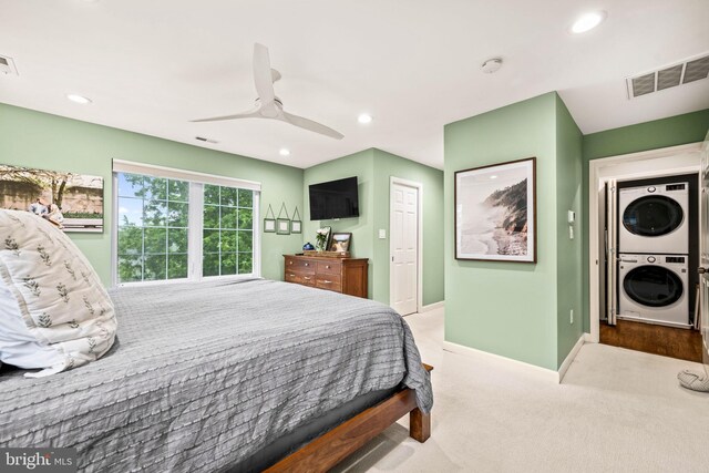 3311 Cameron Mills Rd, Alexandria, VA 22302 - bedroom with stacked washing machine and dryer, carpet flooring, baseboards, a ceiling fan, and recessed lighting