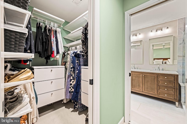 3311 Cameron Mills Rd, Alexandria, VA 22302 - spacious closet featuring bar with sink and light tile patterned flooring