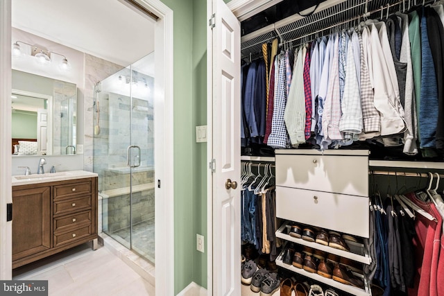 3311 Cameron Mills Rd, Alexandria, VA 22302 - full bathroom with vanity, tile patterned flooring, a stall shower, and a walk in closet