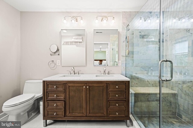 3311 Cameron Mills Rd, Alexandria, VA 22302 - bathroom featuring toilet, double vanity, a shower stall, and tile patterned flooring