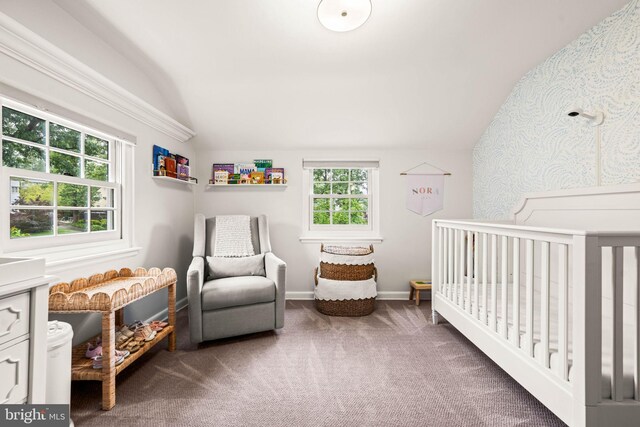 3311 Cameron Mills Rd, Alexandria, VA 22302 - carpeted bedroom with lofted ceiling, a nursery area, and baseboards